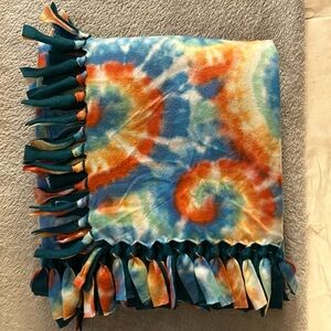 50x60” fleece tie blanket.  Tie Dye pattern fleece with teal fleece backing